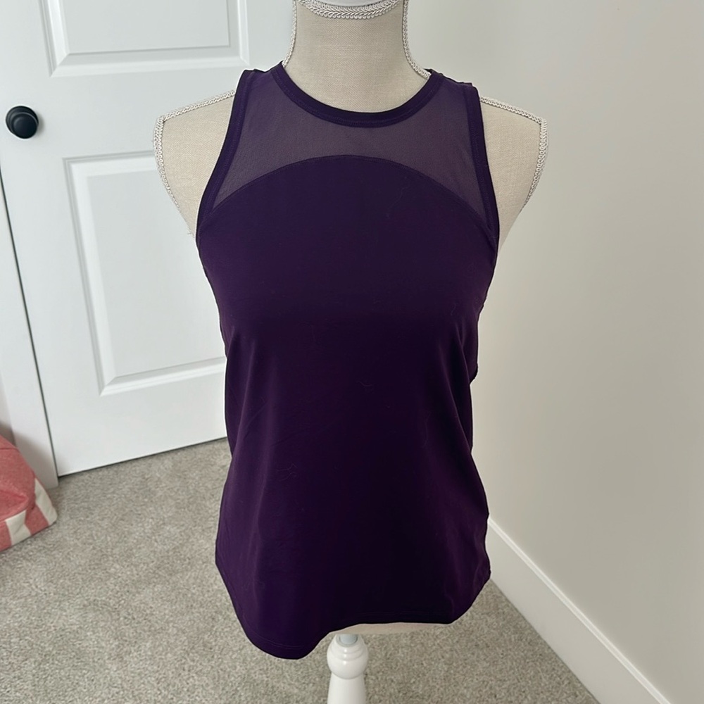 Like new, deep purple tank top by Carrie underwood, with mesh detail